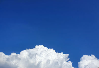 Low angle view of cloudscape against blue sky