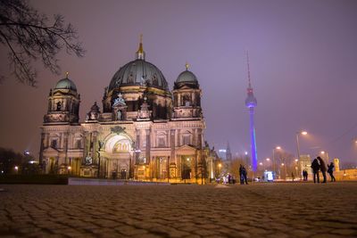 Low angle view of berlin cathedral and fernsehturm at night