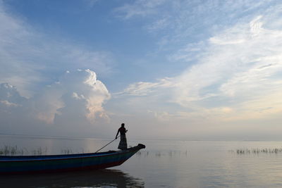 Man standing on beach against sky