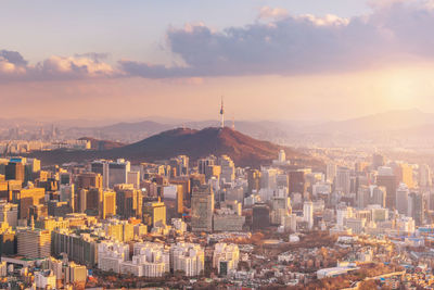 Cityscape against sky during sunset