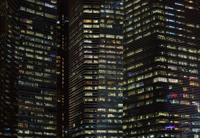 Low angle view of illuminated buildings at night