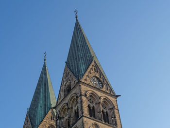 Low angle view of traditional building against clear blue sky