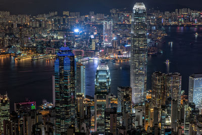 High angle view of city lit up at night