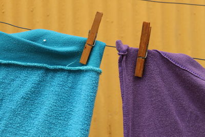 Close-up of clothes hanging on metal