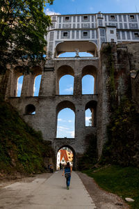 People walking in front of historical building