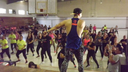 Group of people dancing at music concert