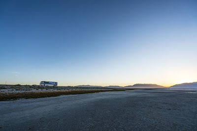 Empty road against clear sky