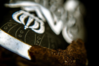 Close-up of rusty metal on table