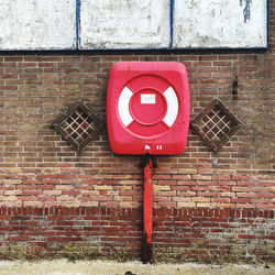 Information sign on brick wall