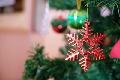 Close-up of christmas decoration hanging on tree