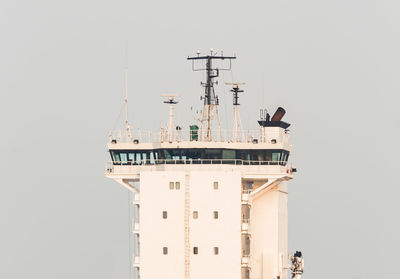 View of container ship in sea against sky