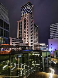 Illuminated buildings in city at night