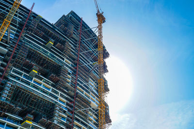 Low angle view of skyscraper against sky