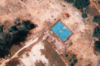 Aerial view of soccer field amidst landscape