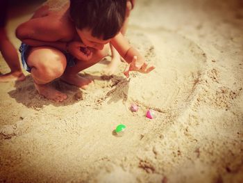 Boy playing on sand