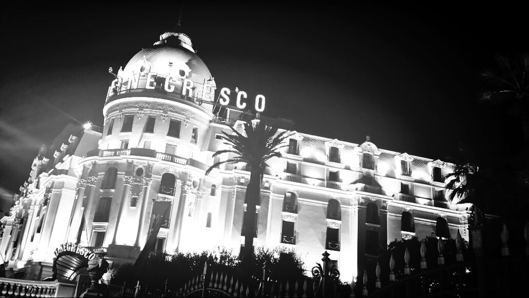 architecture, building exterior, built structure, low angle view, place of worship, night, religion, church, spirituality, city, famous place, travel destinations, illuminated, facade, history, cathedral, clear sky, dome