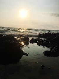 Scenic view of sea against sky at sunset