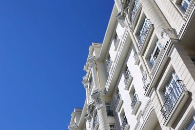 Low angle view of ornate building against clear blue sky