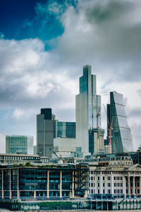 Modern buildings in city against sky