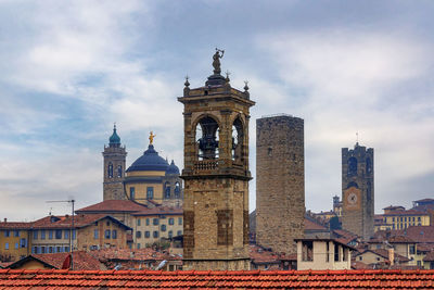 View of buildings in city against sky