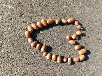 High angle view of heart shape on pebbles