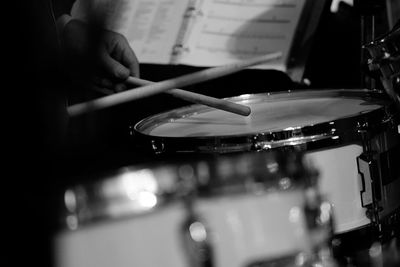 Midsection of man playing piano at music concert