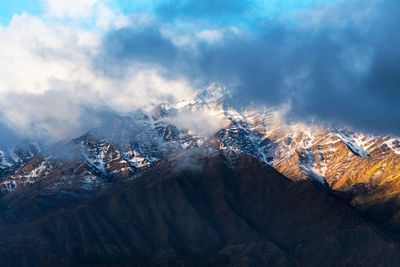 Scenic view of snowcapped mountains against sky