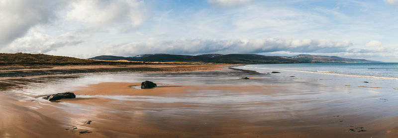 Scenic view of beach against sky