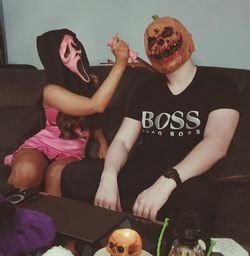 Young couple sitting on table