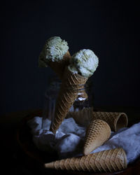 Low angle view of statue against black background