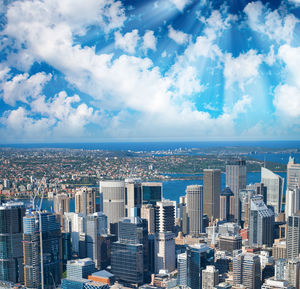 Aerial view of city buildings against sky