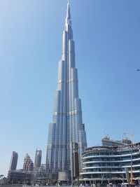 Low angle view of skyscraper against clear sky