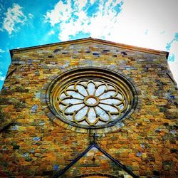 Low angle view of built structure against blue sky