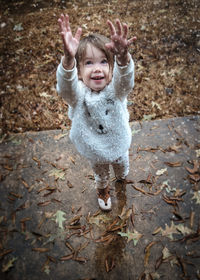 Portrait of little girl playing in snow