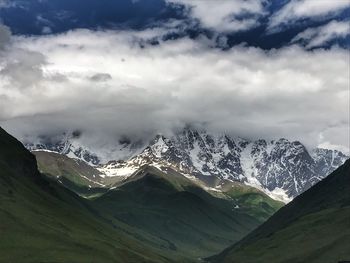 Scenic view of snowcapped mountains against sky