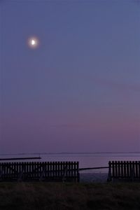 Scenic view of sea against clear sky at sunset