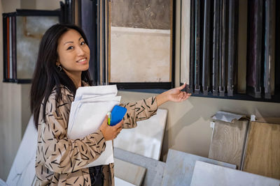 Portrait of young woman using mobile phone