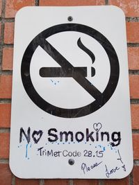 Close-up of warning sign on wall