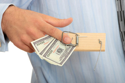 Close-up of hand holding paper