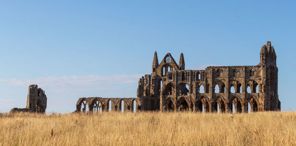 Old ruins against clear sky with whitby abbey 