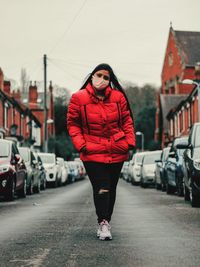 Portrait of woman standing in city 