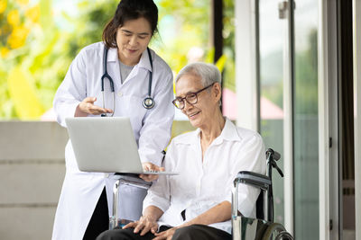 Doctor and patient looking at laptop