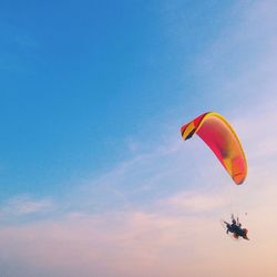 Low angle view of parachute against sky