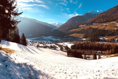 Scenic view of snowcapped mountains against sky during winter