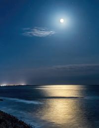 Scenic view of sea against sky at night