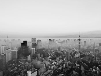 Aerial view of cityscape covered with fog