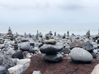 Rocks in sea against sky