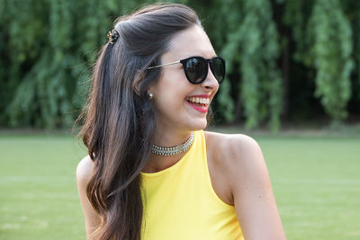 Portrait of young woman wearing sunglasses