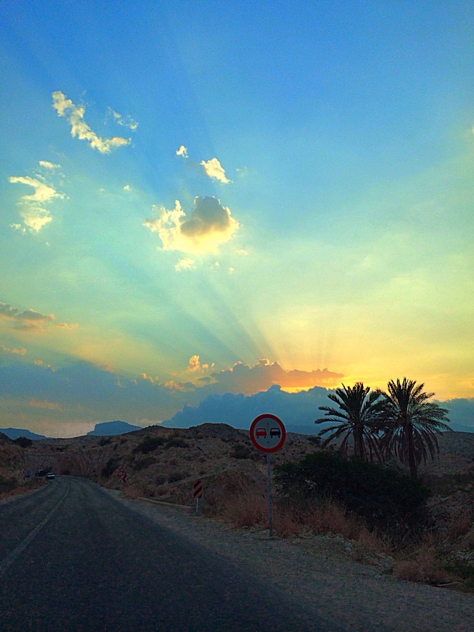 transportation, road, sky, sunset, the way forward, road marking, cloud - sky, tranquil scene, tranquility, landscape, scenics, street, land vehicle, cloud, country road, nature, tree, outdoors, beauty in nature, no people