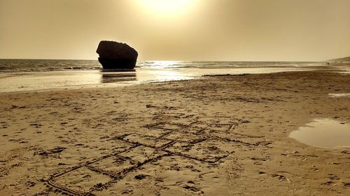 Scenic view of beach against clear sky